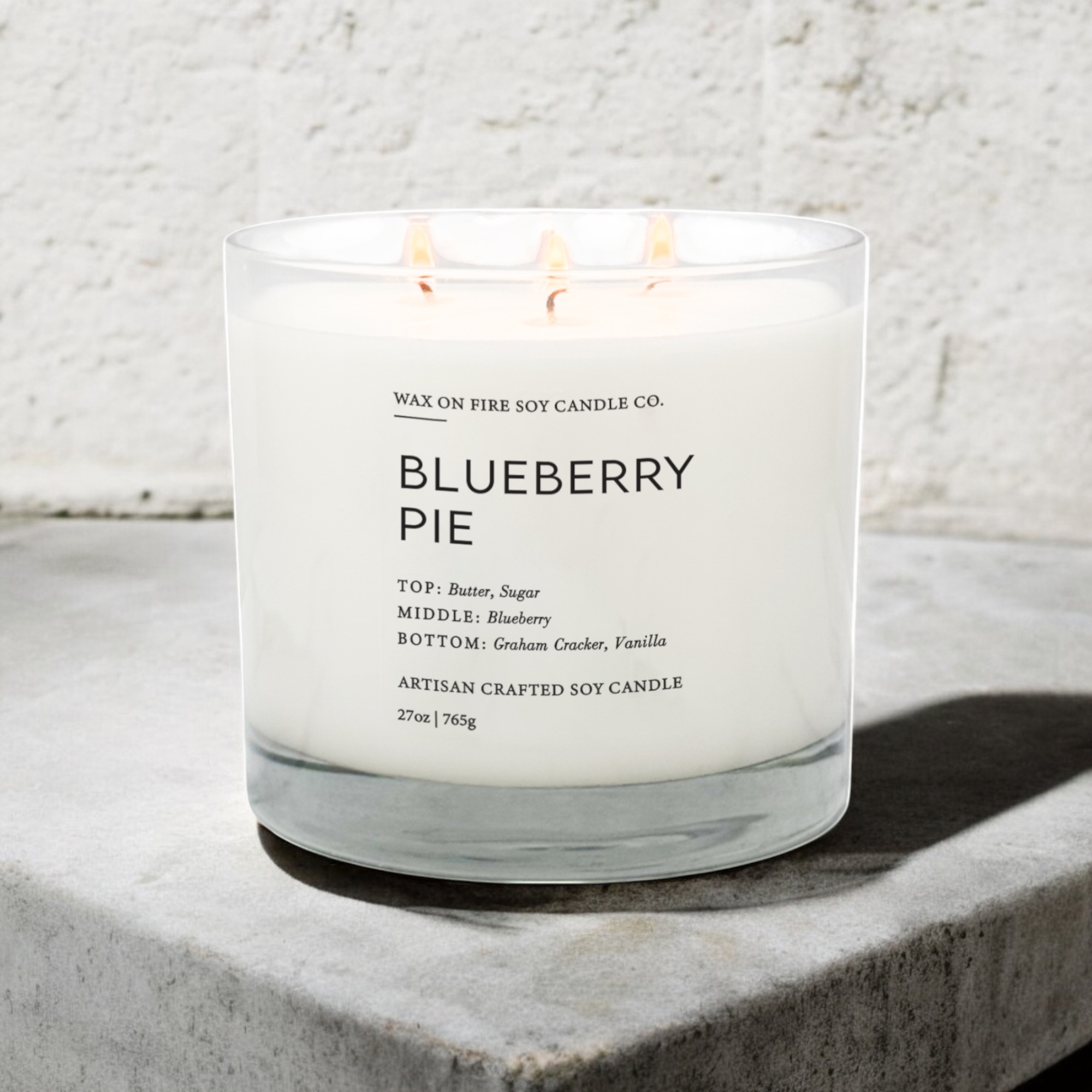 a blueberry pie candle sitting on a table